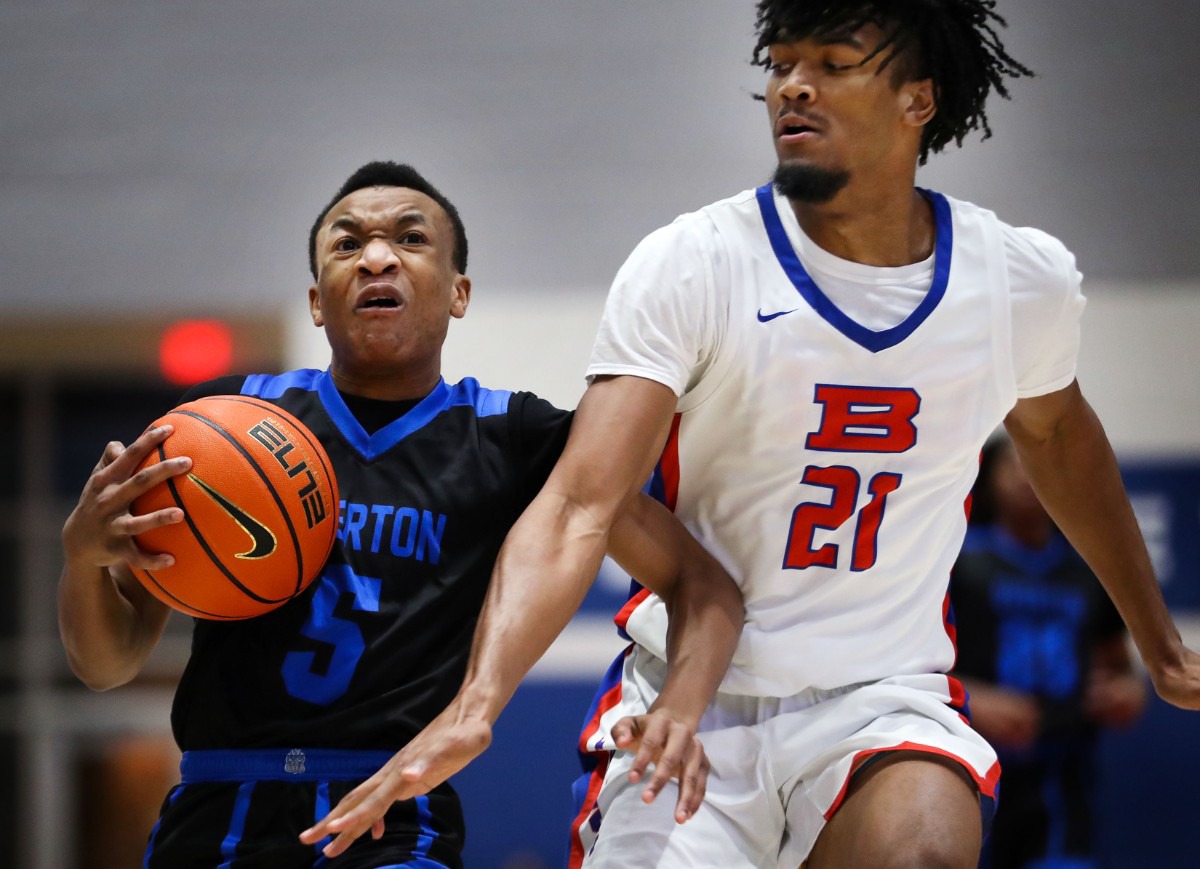 <strong>Overton High guard Jordan Frison (5) drives to the lane during a TSSAA regional quarter final game against Bartlett High Feb. 26, 2022.</strong> (Patrick Lantrip/Daily Memphian)