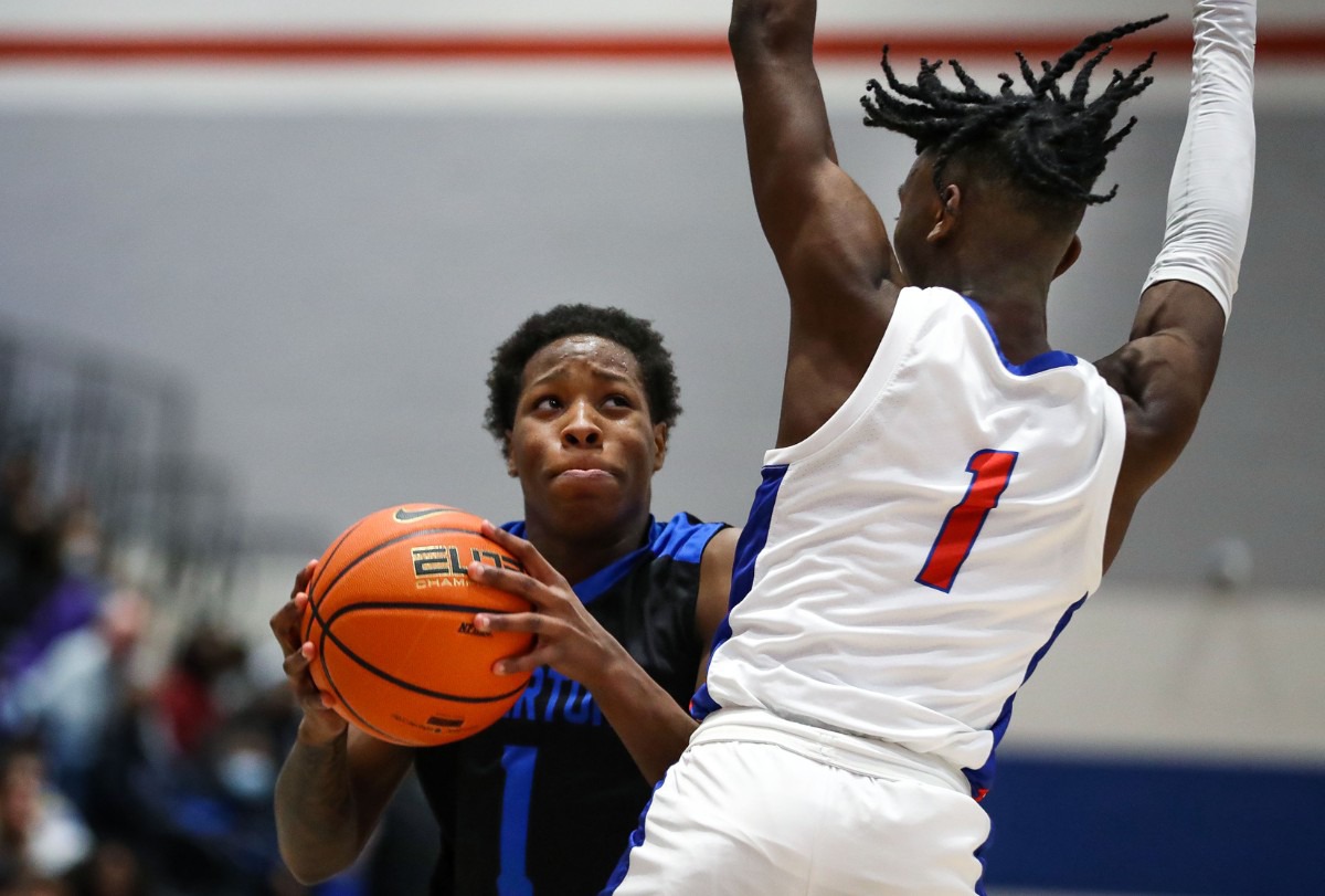 <strong>Overton High guard Jaden Taylor (1) brings the ball up the court during a TSSAA regional quarter final game against Bartlett High Feb. 26, 2022.</strong> (Patrick Lantrip/Daily Memphian)