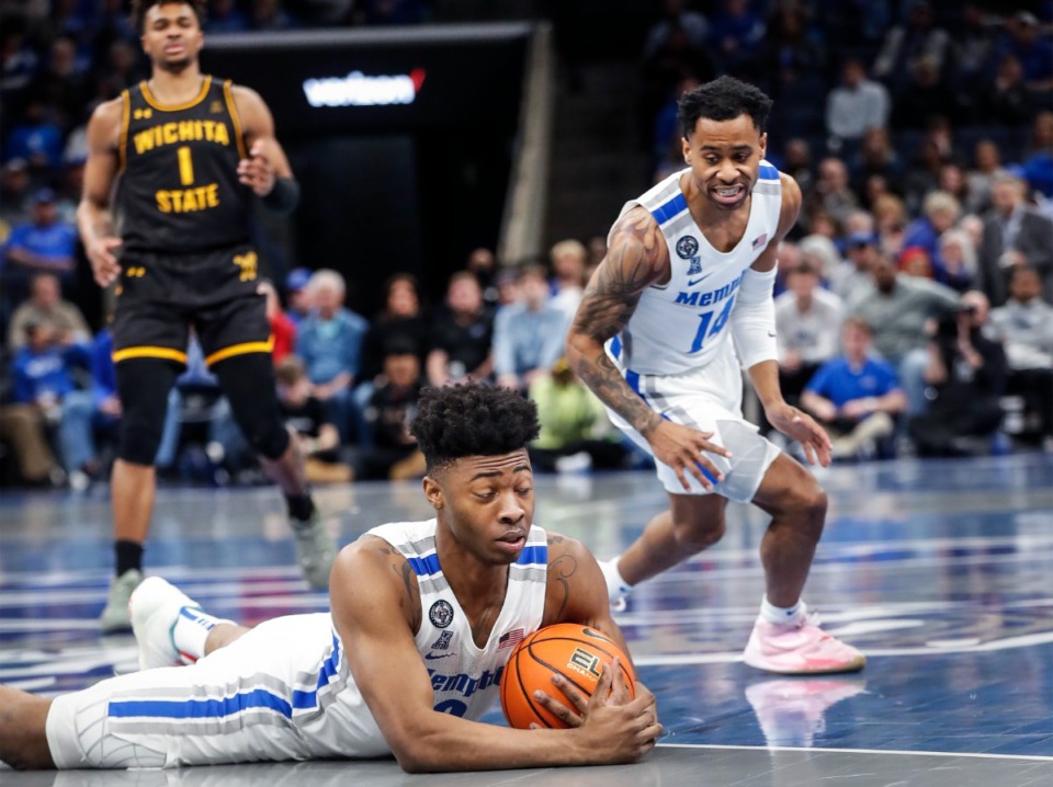 <strong>Memphis defender Earl Timberlake (bottom) grabs a loose ball during action against Wichita State on Sunday, Feb. 27, 2022.</strong> (Mark Weber/The Daily Memphian)