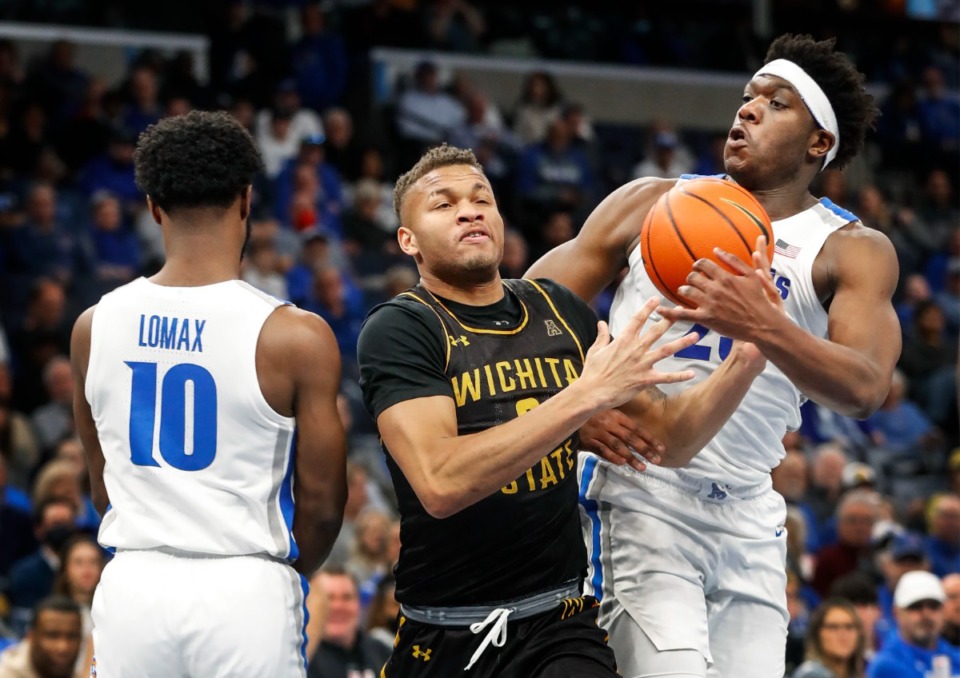 <strong>Memphis defender Malcolm Dandridge (right) tries to the steal the ball away from Wichita State guard Dexter Dennis (left) during action on Sunday, Feb. 27, 2022.</strong> (Mark Weber/The Daily Memphian)