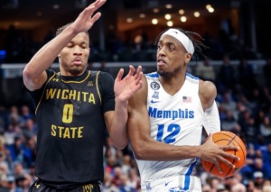 <strong>University of Memphis forward DeAndre Williams (right) drives the lane against Wichita State defender Dexter Dennis (left) during action on Sunday at FedExForum.</strong> (Mark Weber/The Daily Memphian)