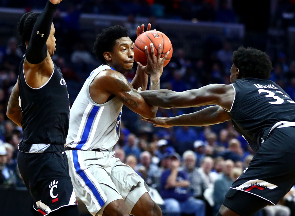 <strong>University of Memphis Tigers guard Kareem Brewton Jr. (5) looks for a teammate to pass to during a game against the Cincinnati Bearcats on Thursday, Feb. 7, 2019. Brewton will play his last regular season home game on March 9 against the Tulsa Golden Hurricane.</strong> (Houston Cofield/Daily Memphian file)