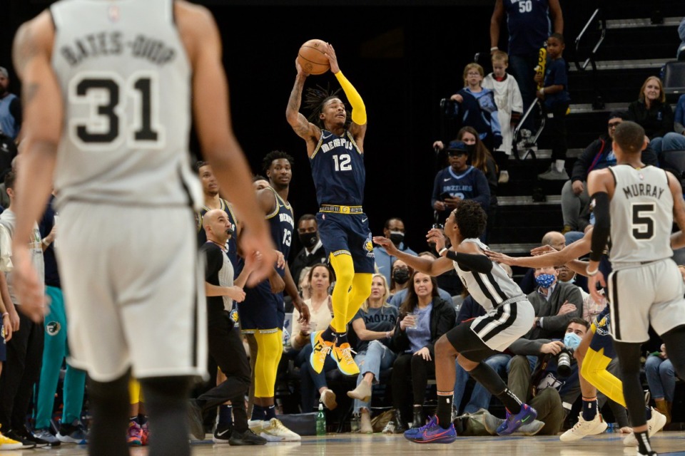 <strong>Memphis Grizzlies guard Ja Morant (12) goes up for a shot at the buzzer at the end of the first half in the game against the San Antonio Spurs on Feb. 28, 2022, at FedExForum.</strong> (Brandon Dill/AP)