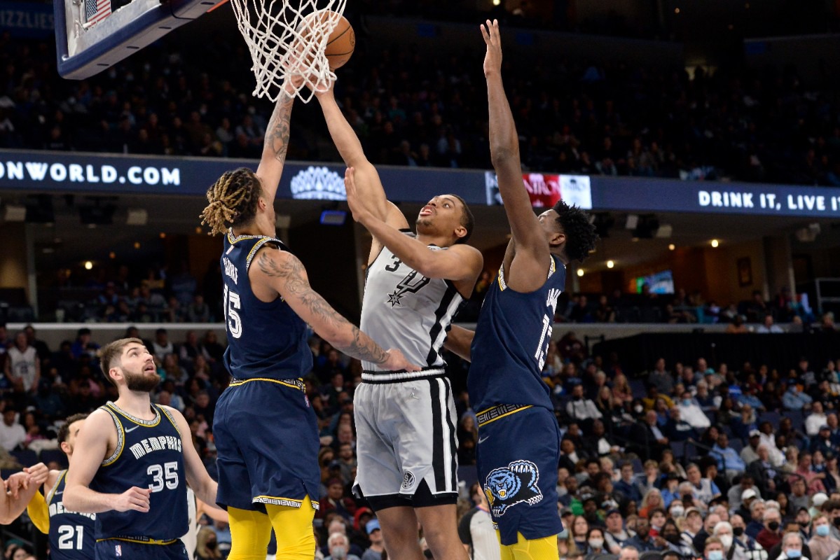 <strong>Memphis Memphis forward Brandon Clarke (15), assisted by forward Jaren Jackson Jr. (13), blocks a shot by&nbsp;San Antonio Spurs forward Keldon Johnson (3) on Feb. 28, 2022, at FedExForum.</strong> (Brandon Dill/AP)