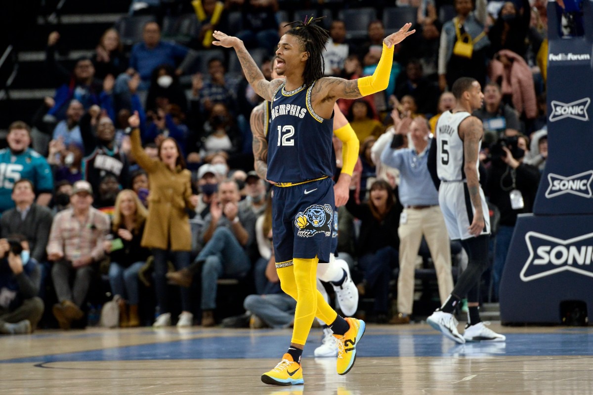 <strong>Memphis Grizzlies guard Ja Morant (12) reacts after a shot in the game against the San Antonio Spurs on Monday, Feb. 28, 2022, at FedExForum.</strong> (Brandon Dill/AP)