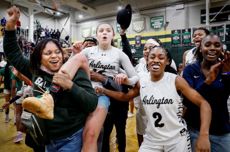 <strong>Arlington guard Alindsey Long (middle) is carried off the court after hitting a buzzer beater to defeat Collierville on Monday, Feb. 28, 2022.</strong> (Mark Weber/The Daily Memphian)