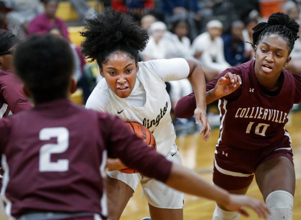<strong>Arlington guard Britani Wells (left) drives the lane against Collierville&rsquo;s Hilary Shikuku (right) on Monday, Feb. 28, 2022.</strong> (Mark Weber/The Daily Memphian)