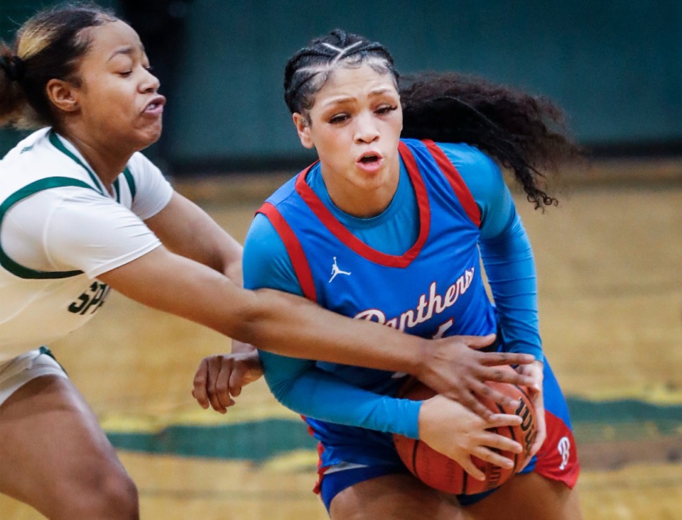 <strong>Bartlett guard Kennedy Claybrooks (left) drives the lane against White Station&rsquo;s Demi Gentry (left) on Monday, Feb. 28, 2022.</strong> (Mark Weber/The Daily Memphian)