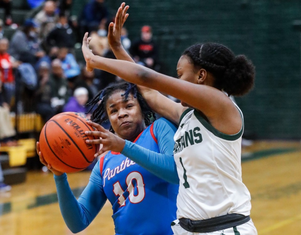 <strong>Bartlett guard Nevah Scott (left) drives the lane against White Station&rsquo;s Mallory Taylor (right) on Monday, Feb. 28, 2022.</strong> (Mark Weber/The Daily Memphian)