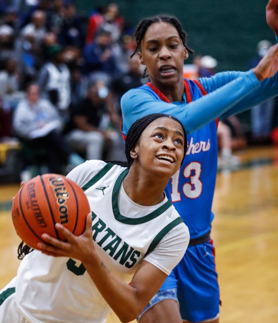 <strong>White Station guard Ramya King (front) drives to the basket against Bartlett&rsquo;s Zoey Rixter (back) on Monday, Feb. 28, 2022.</strong> (Mark Weber/The Daily Memphian)