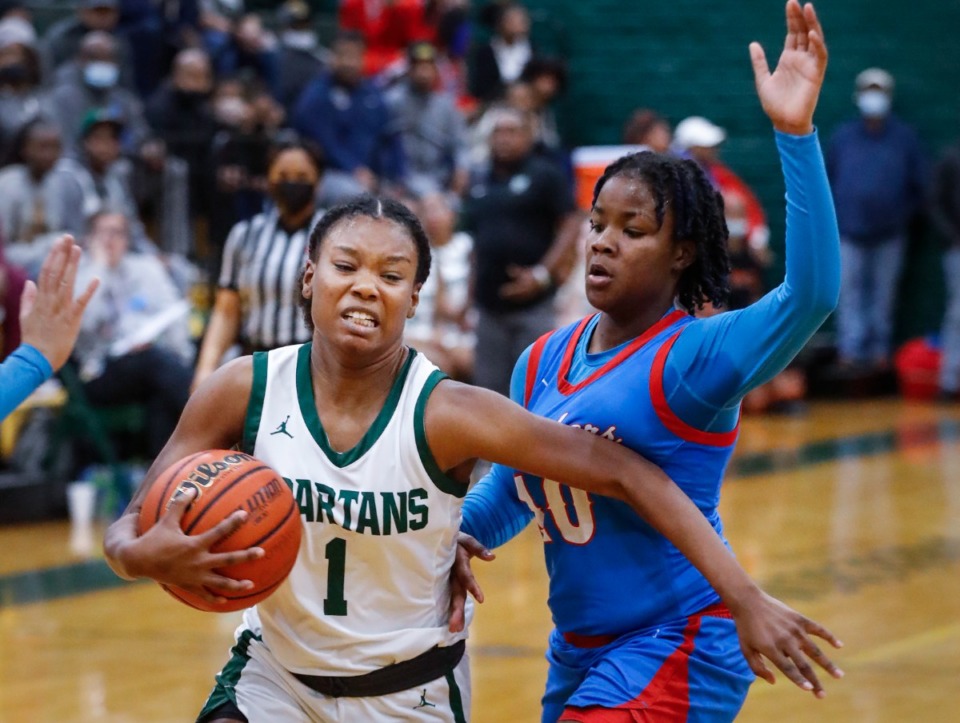 <strong>White Station guard Mallory Taylor drives the lane against Bartlett&rsquo;s Neveah Scott (right) on Monday, Feb. 28, 2022.</strong> (Mark Weber/The Daily Memphian)