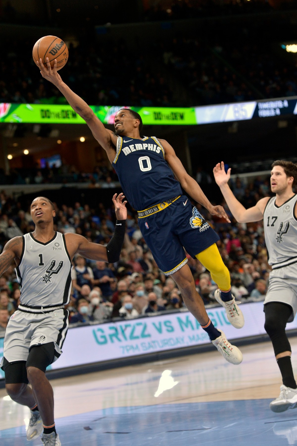 <strong>Memphis Grizzlies guard De'Anthony Melton (0) shoots against San Antonio Spurs guard Lonnie Walker IV (1)&nbsp;on Feb. 28, 2022, at FedExForum.</strong> (Brandon Dill/AP)