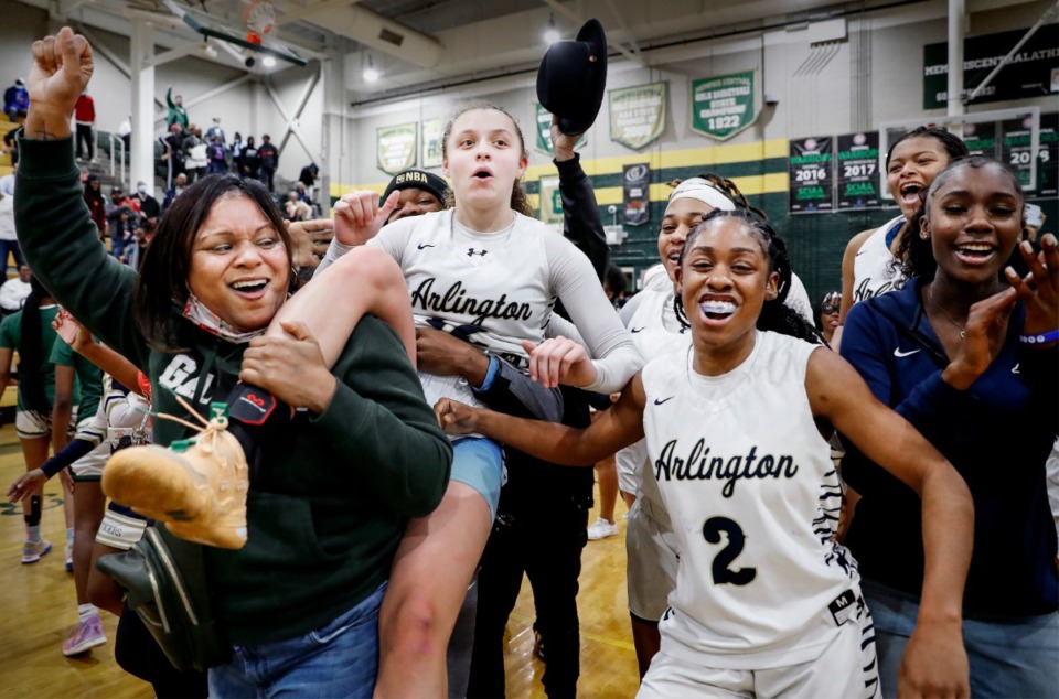 <strong>Arlington guard Alindsey Long (middle) is carried off the court after hit a buzzer beater to defeat Collierville on Monday, Feb. 28, 2022.</strong> (Mark Weber/The Daily Memphian)