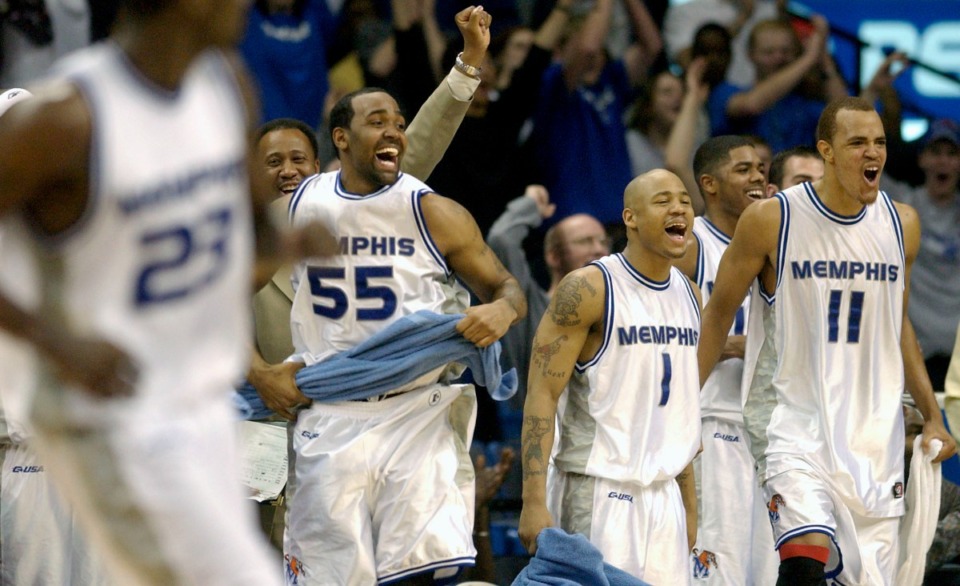 <strong>Memphis' Arthur Barclay (55), Antonio Burks (1), and Duane Erwin (11) celebrate Memphis' 83-56 victory over Texas Christian on March 3, 2004, in The Pyramid.</strong> (Lance Murphey/AP file)