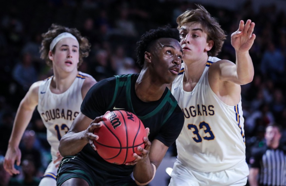 <strong>FACS guard Daniel Egbuniwe (0) tries to split two defenders during the TSSAA Div. II Class A state championship game against Goodpasture Christian School Hooper Eblen Center in Cookeville, Tennessee.</strong> (Patrick Lantrip/Daily Memphian)