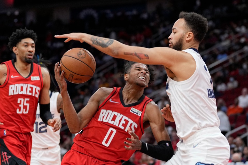 <strong>Houston Rockets' Jalen Green (0) drives to the basket as Memphis Grizzlies' Kyle Anderson defends during the first half of an NBA basketball game Sunday, March 6, 2022, in Houston.</strong> (AP Photo/David J. Phillip)