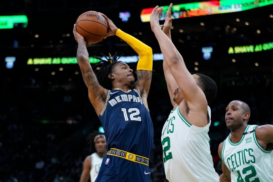 <strong>Memphis Grizzlies guard Ja Morant (12) drives to the basket during an NBA basketball game, Thursday, March 3, 2022 in Boston.</strong> (AP Photo/Charles Krupa)