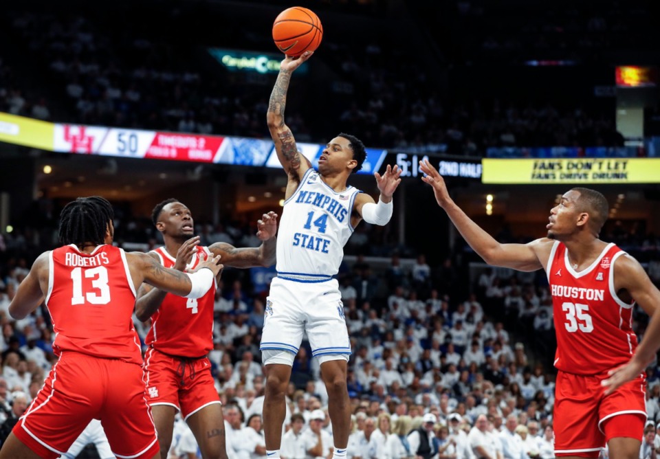 <strong>Memphis guard Tyler Harris (middle) puts up a shot during action against Houston on Sunday, March 6, 2022.</strong> (Mark Weber/The Daily Memphian)