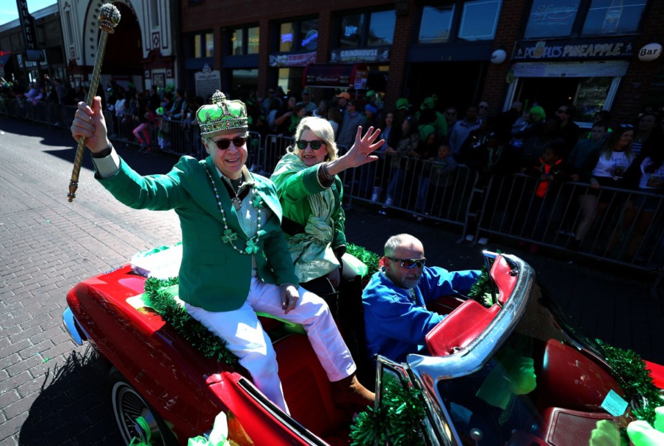 Bob Berry (left) and Lucy Woodson (right) cruise down Beale St. on a vintage corvette during the 2019 St. Patrick's Day Parade. Thousands of locals and tourists gathered along the iconic Memphis street to celebrate the holiday. (Houston Cofield/Daily Memphian)