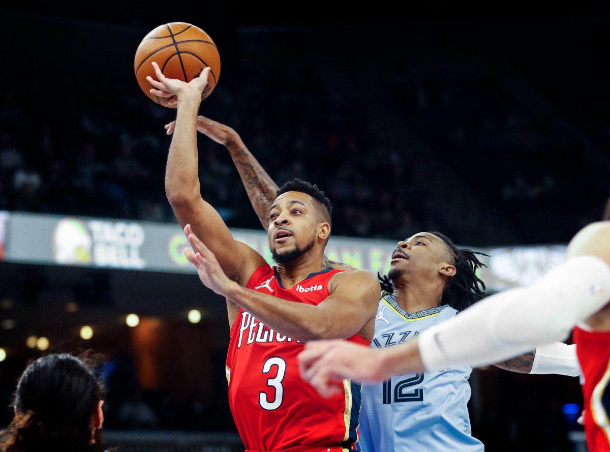 <strong>Memphis Grizzlies guard Ja Morant (right) blocks the shot of New Orleans Pelicans guard CJ McCollum (left) on Tuesday, March 8, 2022.</strong> (Mark Weber/The Daily Memphian)