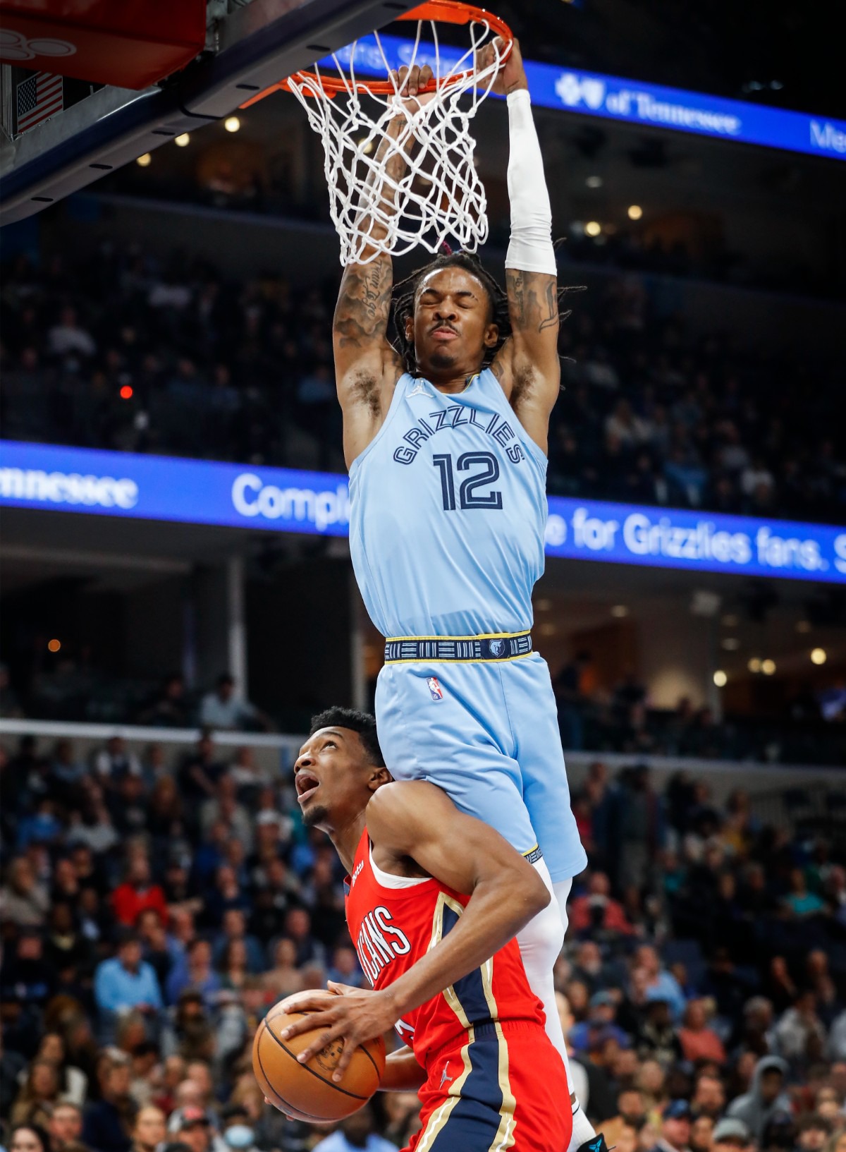 <strong>Memphis Grizzlies guard Ja Morant (top) fouls New Orleans Pelicans forward Herbert Jones (bottom) on Tuesday, March 8, 2022.</strong> (Mark Weber/The Daily Memphian)