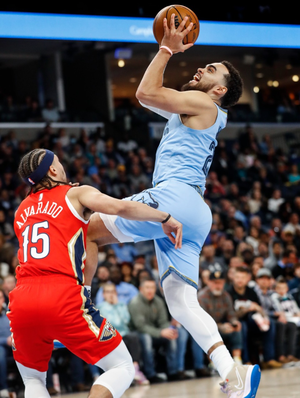 <strong>Memphis Grizzlies guard Tyus Jones (right) drives the lane against New Orleans&rsquo; Jose Alvarado (left) on Tuesday, March 8, 2022.</strong> (Mark Weber/The Daily Memphian)