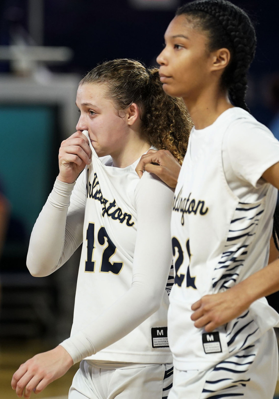 <strong>Arlington&rsquo;s Alindsey Long (left) is comforted by Taylor Dupree as they leave the court after losing to Beech 62-52 on Wednesday March 9, in Murfreesboro.</strong> (Mark Weber/The Daily Memphian)