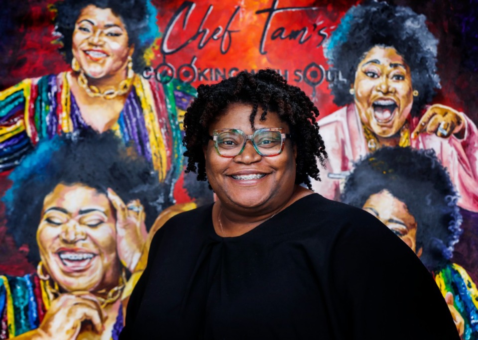 <strong>Chef Tam&rsquo;s Underground&nbsp;Caf&eacute; owner Tamra Patterson stands in front of a painting that captures her in multiple poses</strong>.(Mark Weber/The Daily Memphian)