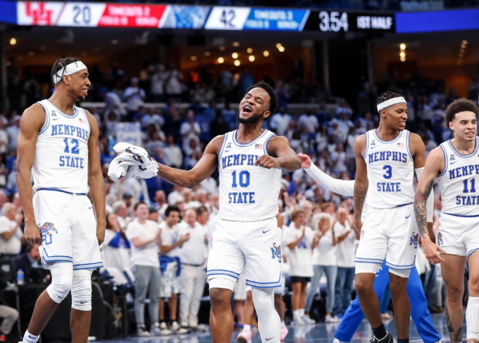 <strong>Memphis guard Alex Lomax (middle) celebrates the win against Houston on Sunday, March 6. The Tigers begin their postseason run in the American Athletic Conference Tournament Friday, March 11, in Fort Worth, Texas.</strong> (Mark Weber/The Daily Memphian)
