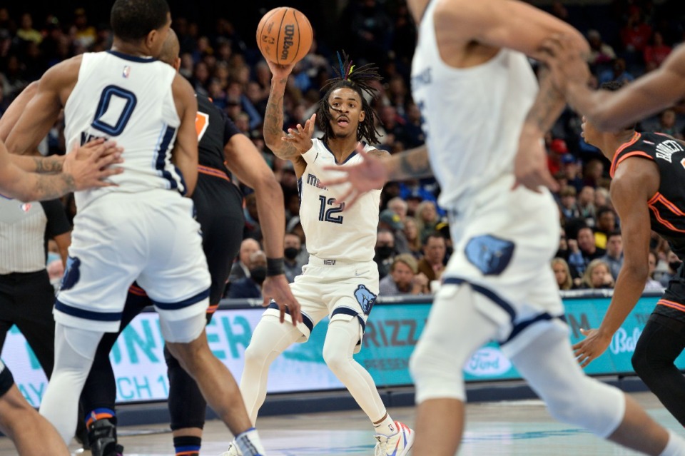 <strong>Memphis Grizzlies guard Ja Morant (12) passes against the New York Knicks on March 11.</strong> (Brandon Dill/AP)