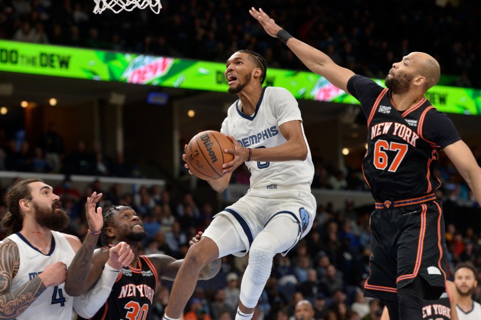 <strong>Memphis Grizzlies guard Ziaire Williams (8) jumps to shoot next to New York Knicks center Taj Gibson (67) on March 11.</strong> (Brandon Dill/AP)