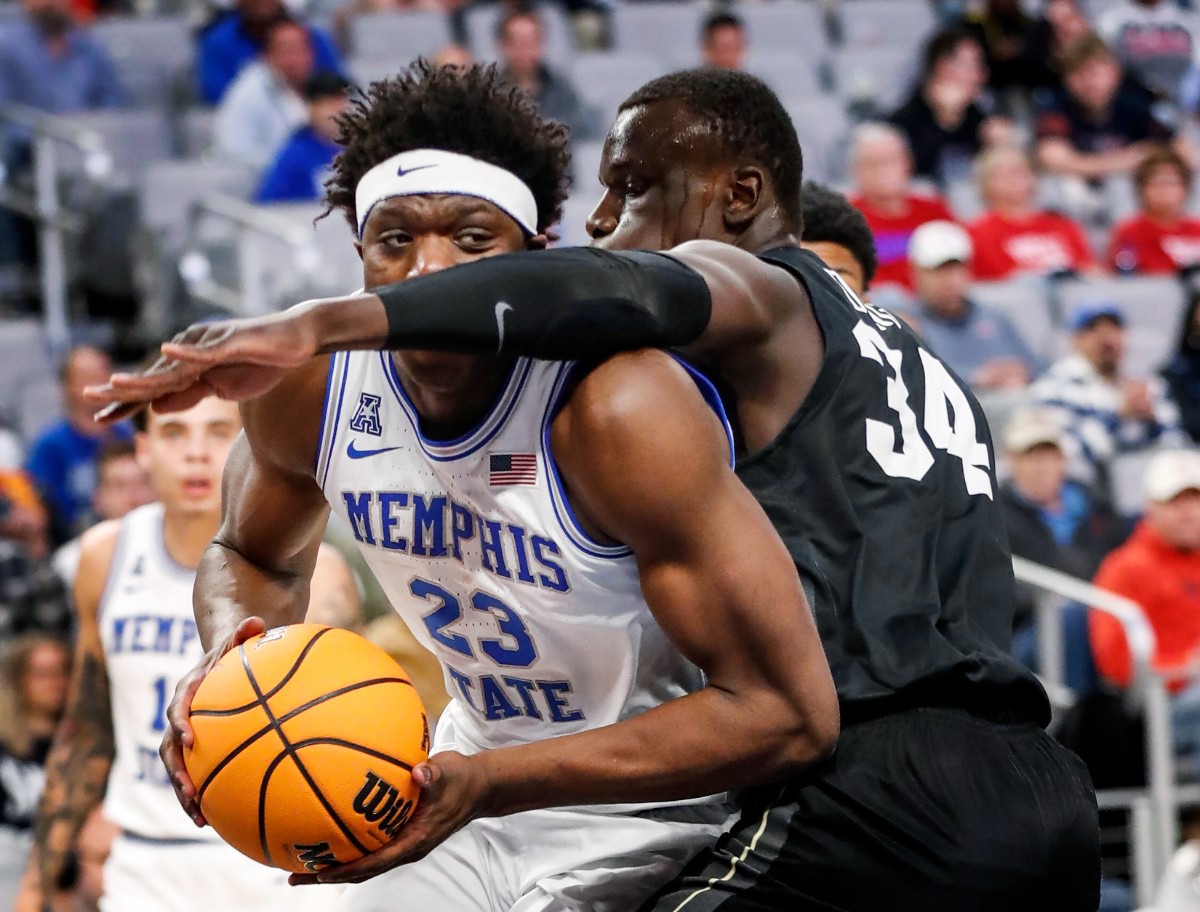 <strong>Tigers center Malcolm Dandridge (left) drives the lane against UCF&rsquo;s Cheikh Mbacke Diong (right) on Friday, March 11, 2022, in Fort Worth, Texas.</strong> (Mark Weber/The Daily Memphian)