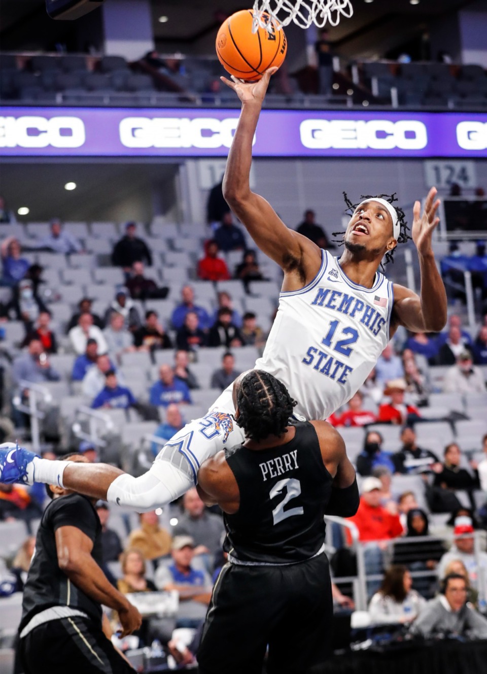 <strong>Tigers forward DeAndre Williams (top) drives to the basket against UCF&rsquo;s Darius Perry (bottom) on Friday, March 11, 2022, in Fort Worth, Texas.</strong> (Mark Weber/The Daily Memphian)