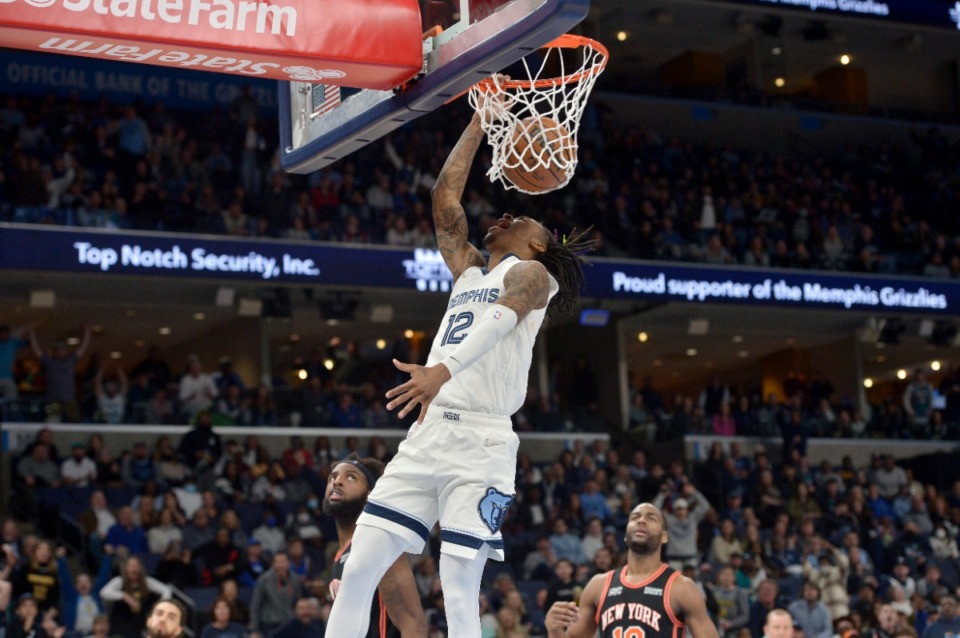 <strong>Memphis Grizzlies guard Ja Morant (12) dunks the ball against the New York Knicks on March 11, 2022, at FedExForum.</strong> (Brandon Dill/AP)