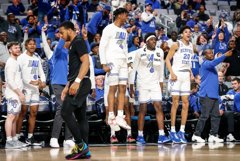 <strong>Tigers celebrate on the bench during the final minutes of the 85-69 victory over UCF on Friday, March 11, 2022, in Fort Worth, Texas.</strong> (Mark Weber/The Daily Memphian)