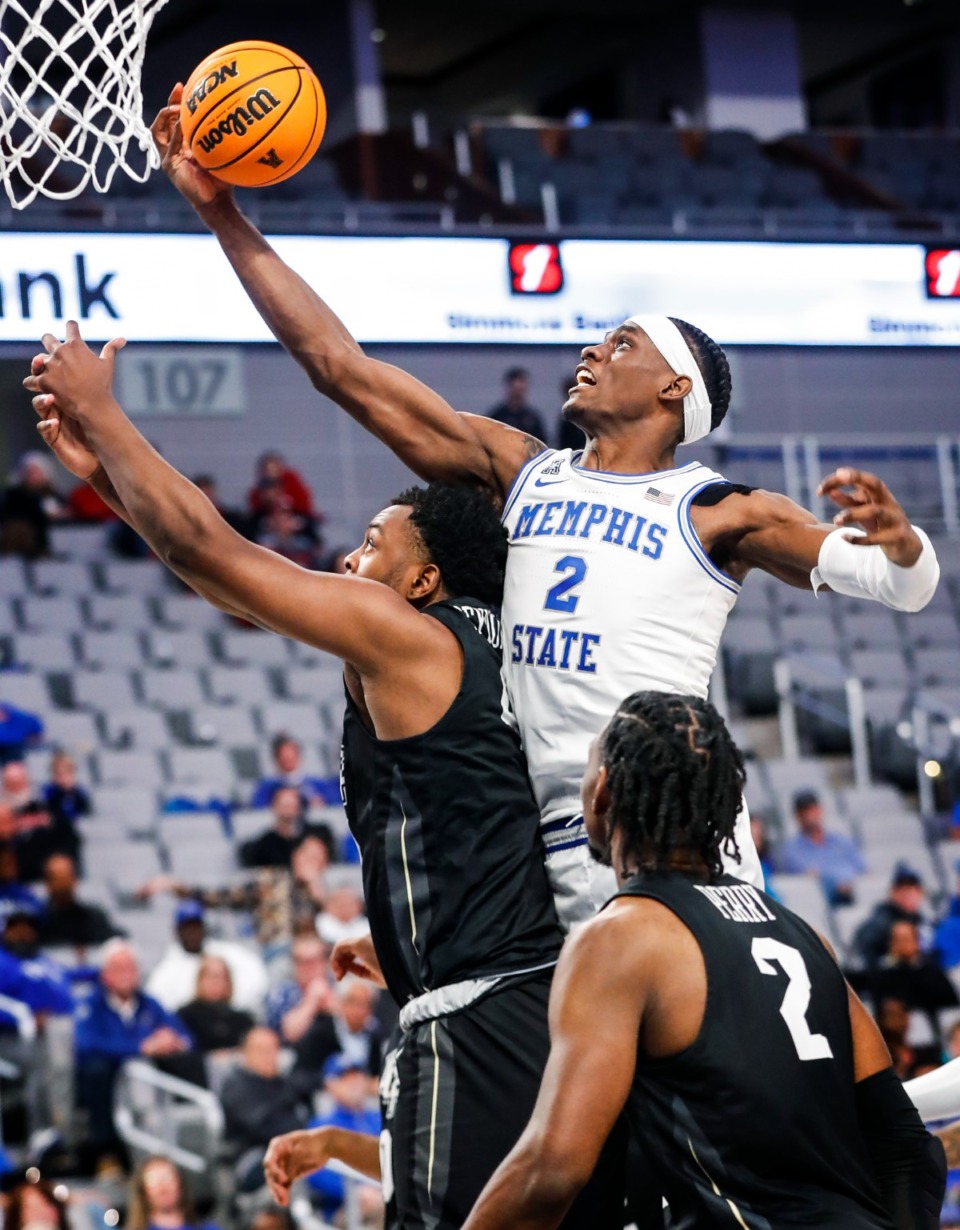 <strong>Tigers center Jalen Duren (top) grabs a rebound against the UCF defense on Friday, March 11, 2022, in Fort Worth, Texas.</strong> (Mark Weber/The Daily Memphian)