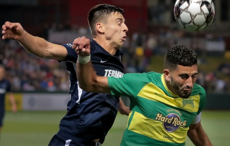 <strong>Wesley Charpie (left) goes head-to-head with Tampa's Sebastian Guenzatti during the 901 FC season opener against the Tampa Rowdies at Autozone Park on March 9, 2019. The Rowdies beat Memphis 1-0 with a penalty kick early in the first half.</strong> (Jim Weber/Daily Memphian)