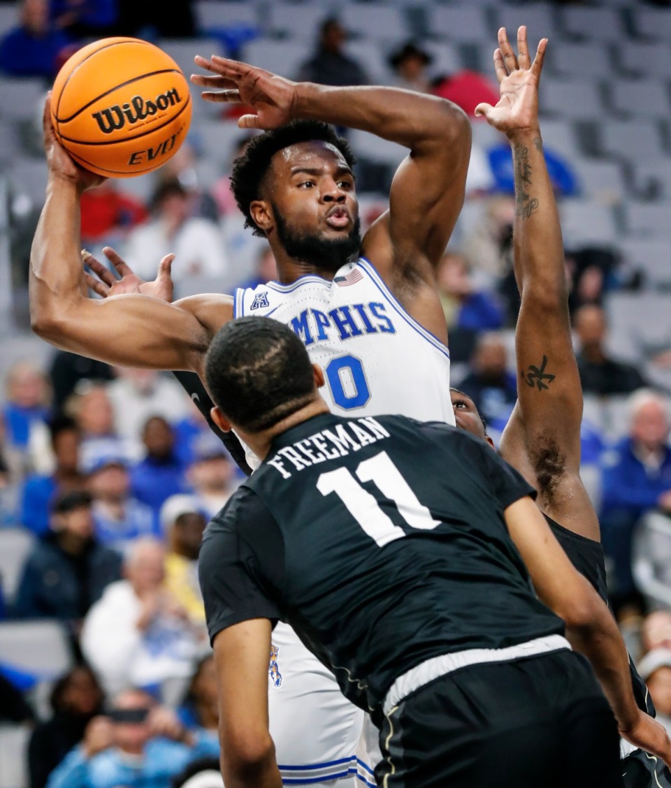 <strong>Tigers guard Alex Lomax looks to make a pass against UCF on Friday, March 11, 2022, in Fort Worth, Texas.</strong> (Mark Weber/The Daily Memphian)