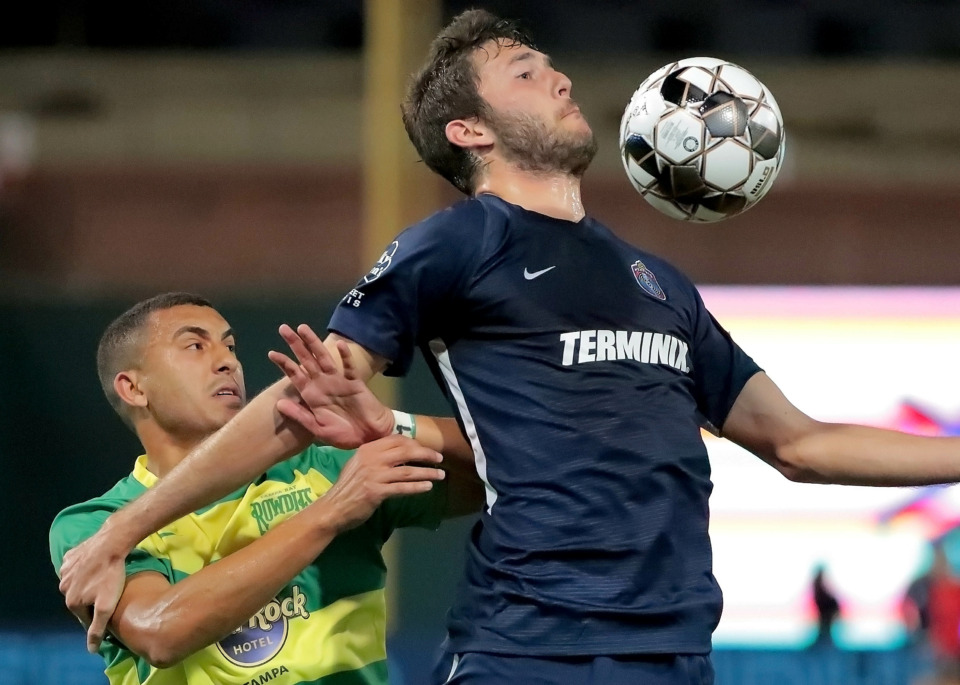<strong>Forward Elliot Collier (right) blocks out Tampa's Tarek Morad during the 901 FC season opener against the Tampa Rowdies at Autozone Park on March 9, 2019. The Rowdies beat Memphis 1-0 with a penalty kick early in the first half.</strong> (Jim Weber/Daily Memphian)
