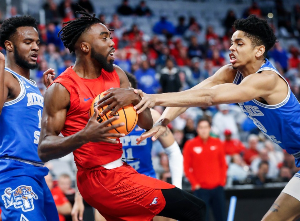<strong>Tigers defender Josh Minott (right) tries to grab rebound away form SMU guard Emmanuel Bandoumel (left) during action on Saturday, March 12, 2022 in Fort Worth, Texas.</strong> (Mark Weber/The Daily Memphian)
