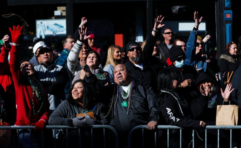 <strong>Parade goers jostle for beads during the 49th annual St. Patrick's Day Parade on Beale Street March 12, 2022.</strong> (Patrick Lantrip/Daily Memphian)