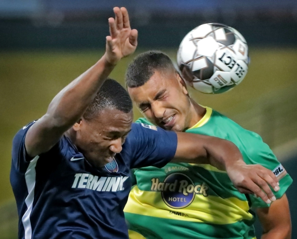 <strong>Rashawn Dally (left) goes head-to-head with Tampa's Tarek Morad during the 901 FC season opener against the Tampa Rowdies at Autozone Park on March 9, 2019. The Rowdies beat Memphis 1-0 with a penalty kick early in the first half.</strong> (Jim Weber/Daily Memphian)