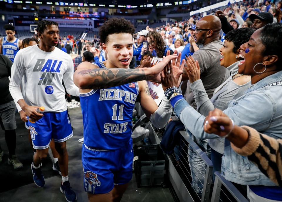 <strong>Tigers Lester Quinones high-fives fans after defeating SMU 70-63 on Saturday, March 12, 2022 in Fort Worth, Texas.</strong> (Mark Weber/The Daily Memphian)