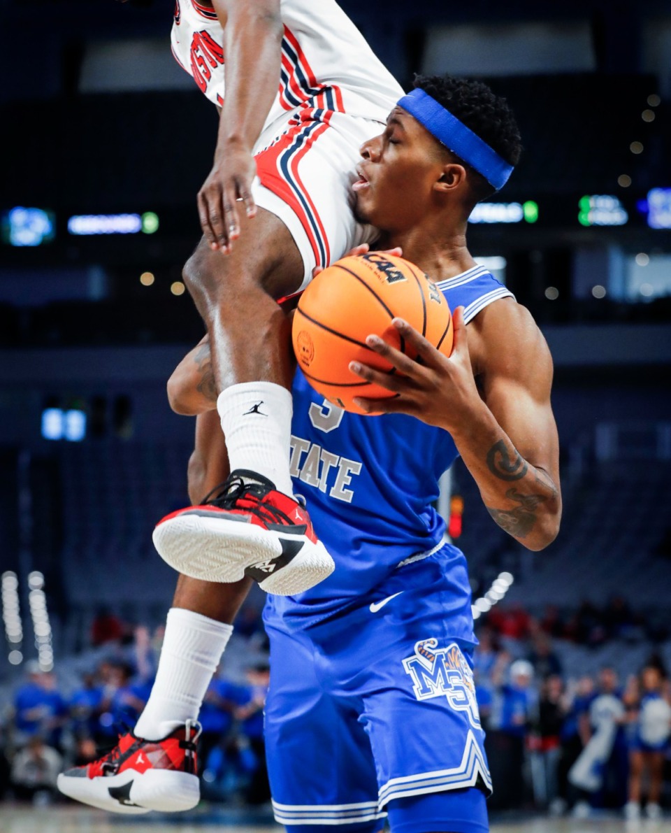 <strong>Tigers guard Landers Nolley II (right) is fouled during action against Houston on Sunday, March 13, 2022 in the AAC Championship game in Fort Worth, Texas.</strong> (Mark Weber/The Daily Memphian)