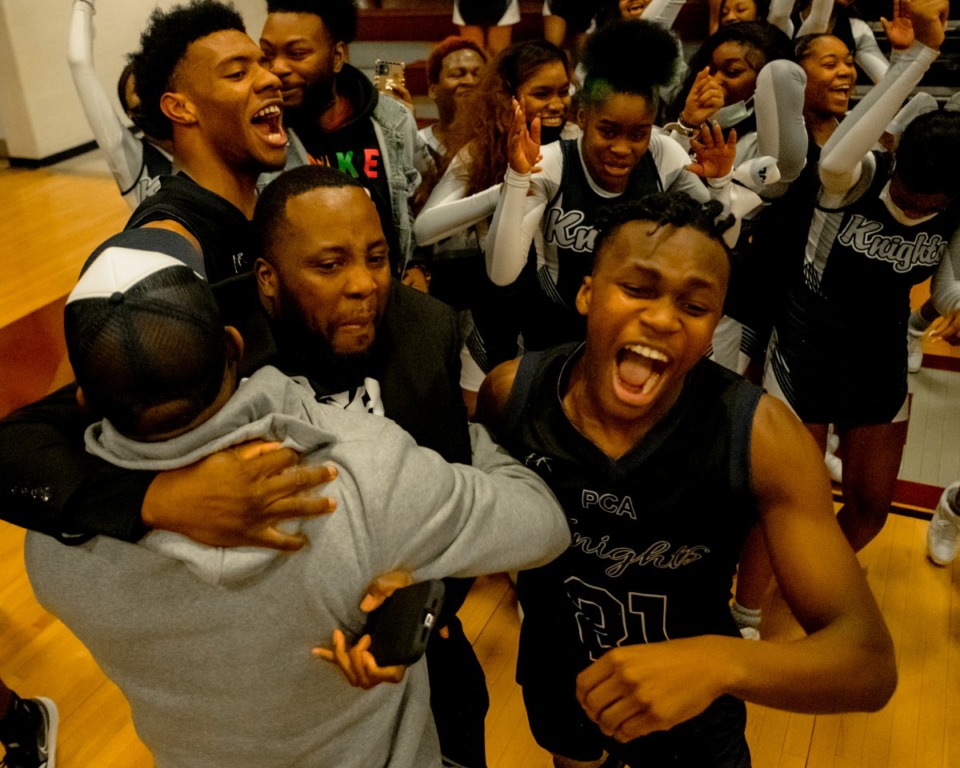 <strong>Power Center Academy players, coaches and fans celebrate March 7 after defeating Douglass High Scool in a buzzer-beater shot.&nbsp;The team is bound for the first state tournament in school history.</strong> (Houston Cofield/Special To The Daily Memphian)