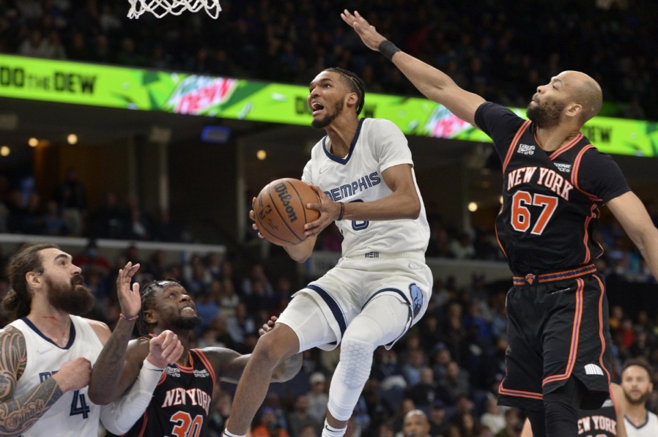 <strong>Memphis Grizzlies guard Ziaire Williams (8) jumps to shoot next to New York Knicks center Taj Gibson (67) during the second half of an NBA basketball game Friday, March 11, 2022, at FedExForum.</strong> (Brandon Dill/AP file)