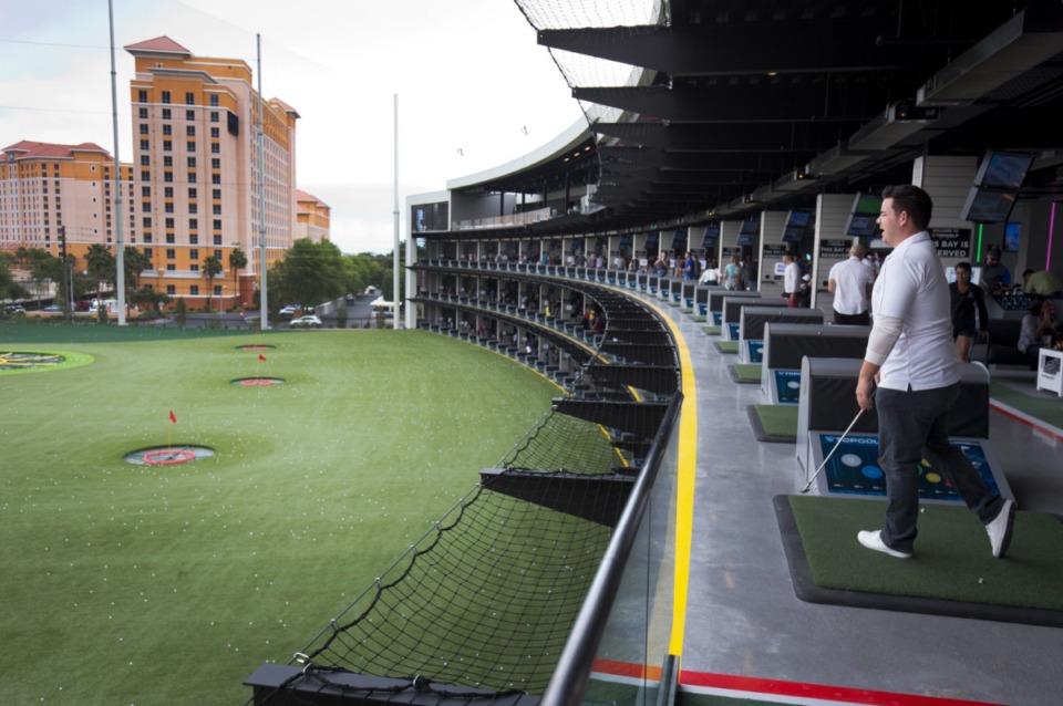 <strong>In this Tuesday, May 17, 2016, photo, Nate Greene watches his drive from the "Owners Suite" at Topgolf Las Vegas. Time has healed some recession-generated wounds, but golf experts largely agree it isn't the thriving business it once was in Las Vegas.</strong> (Steve Marcus/AP file)