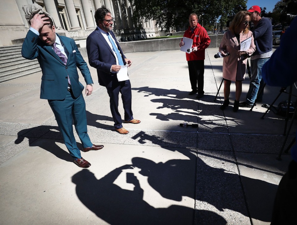 <strong>Lawyers Aaron Neglia (left) and Murray Wells talk to the media on October 11, 2018 at the Shelby County Courthouse.&nbsp;Neglia pleaded guilty in a scheme in which he paid former Shelby County Assistant District Attorney Glenda Adams for confidential information on traffic accident reports.</strong> (Jim Weber/Daily Memphian file)