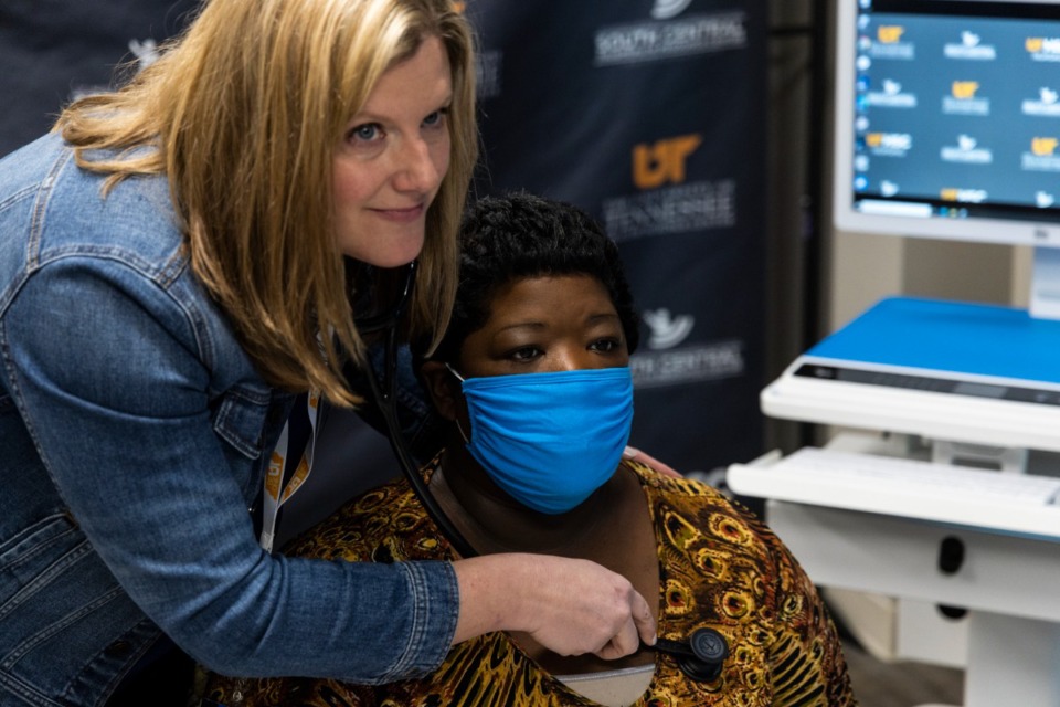 <strong>Karen Nellis, left, and Tammy McCray, right, show an example of a telehealth appointment while at the UTHSC Satellite Telehealth Training Center on March 14.</strong> (Brad Vest/Special to The Daily Memphian)