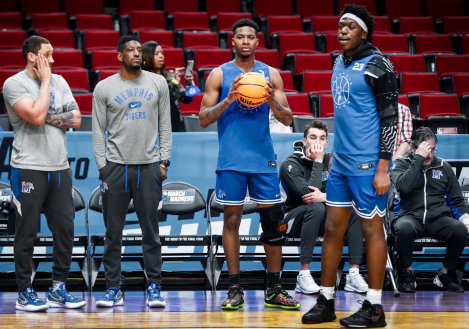 <strong>Tigers guard Landers Nolley II (middle right) watches from the sidelines while wearing a knee brace on Wednesday, March 16, during practice day of the NCAA Tournament in Portland, Oregon.</strong> (Mark Weber/The Daily Memphian)